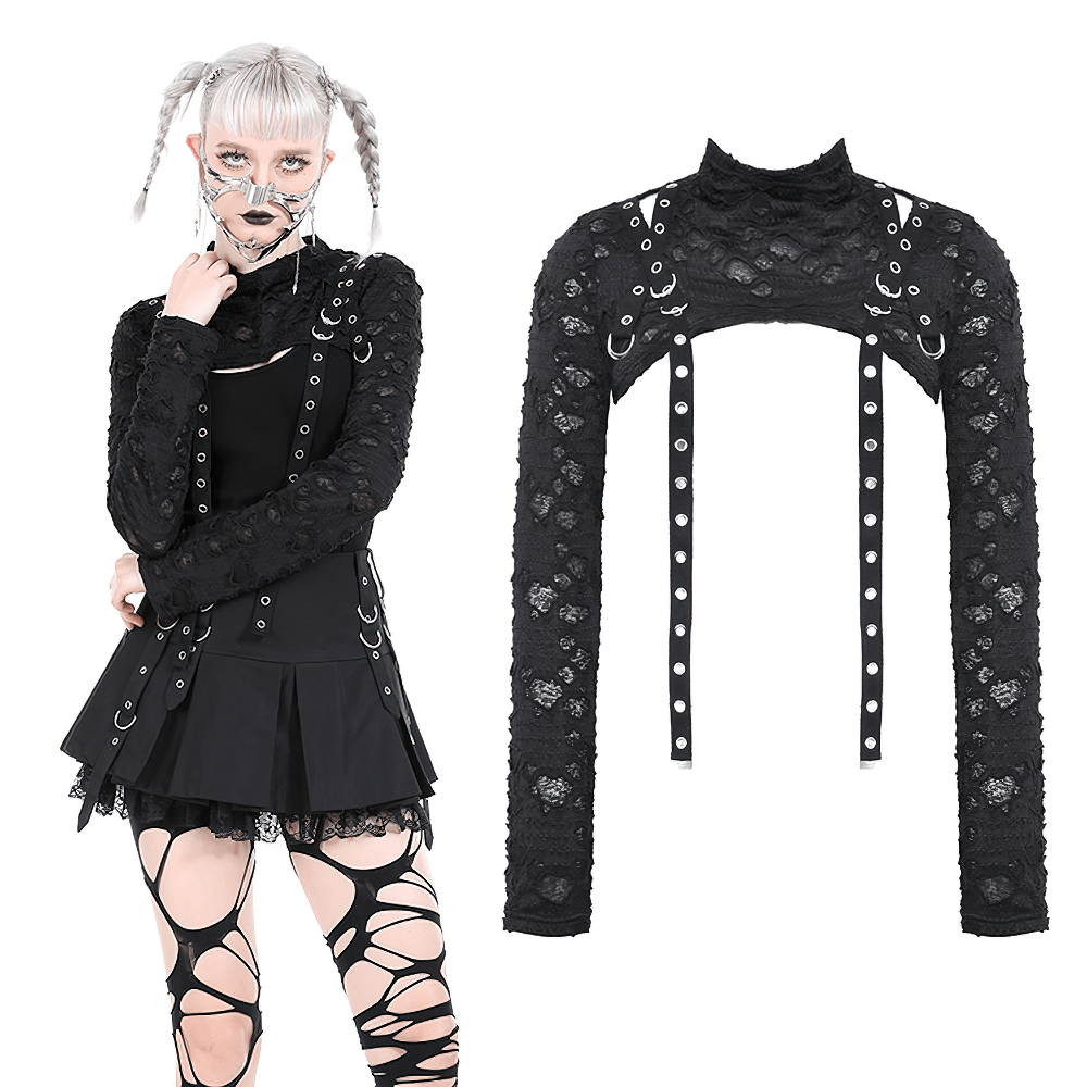 Chic black ripped crop top with long sleeves and metal accents, perfect for a bold fashion statement.