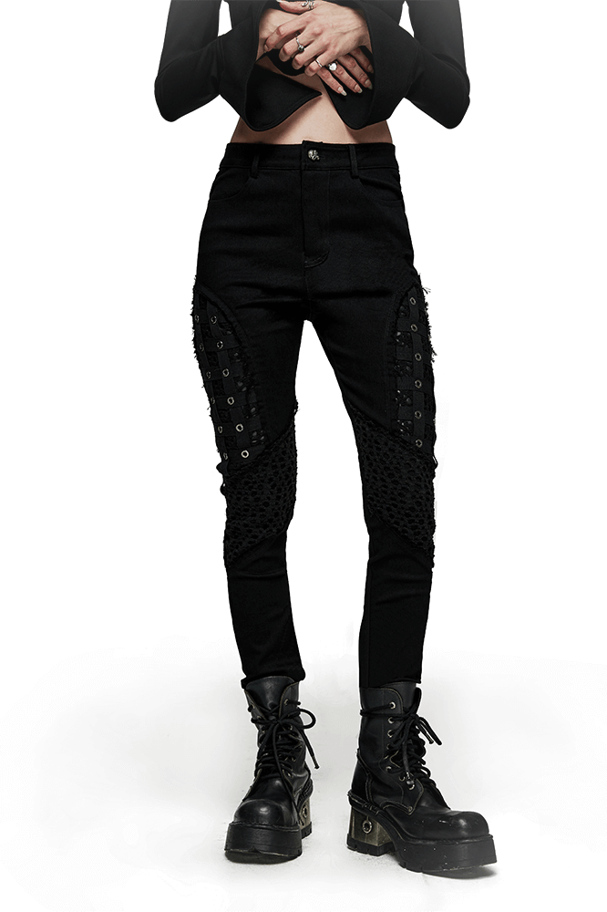 Chic black rubberized mesh punk skinny pants with geometric eyelet detailing, embodying gothic style and edgy fashion.