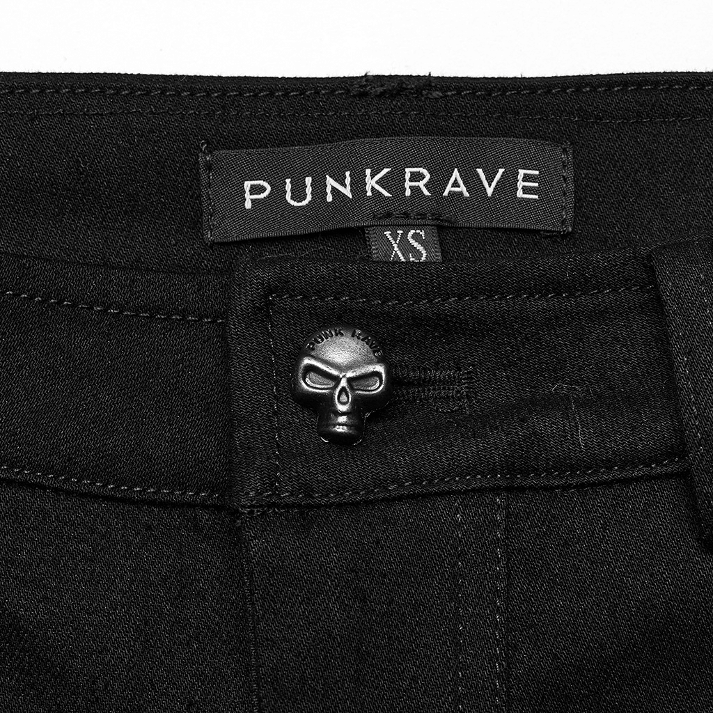 Close-up of chic black pants featuring skull button and Punkrave label, showcasing gothic style and edgy design.