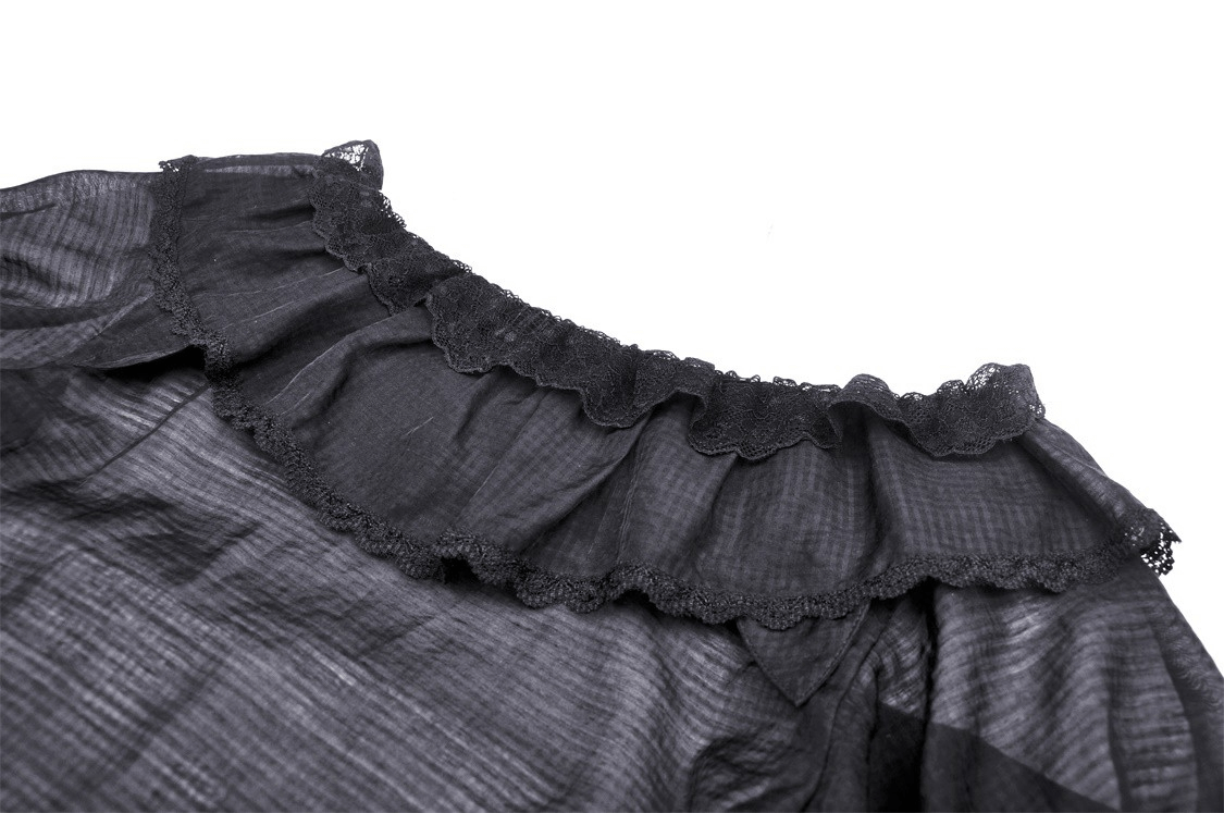 Close-up of a black Victorian ruffle top showcasing delicate lace trim and puff sleeve details.