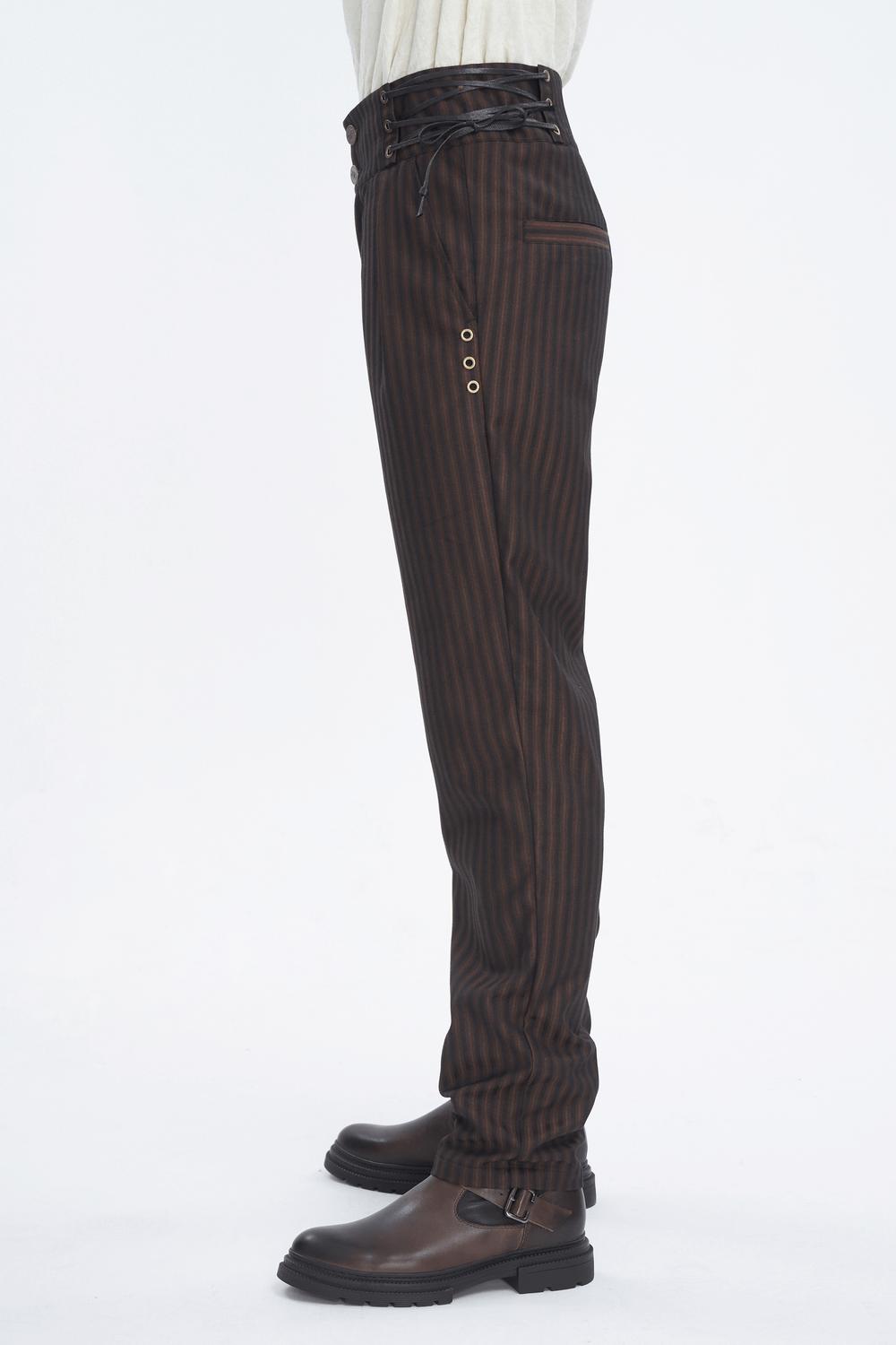 Chic brown striped trousers with lace-up sides, tailored for a relaxed fit and wide legs, paired with stylish boots.