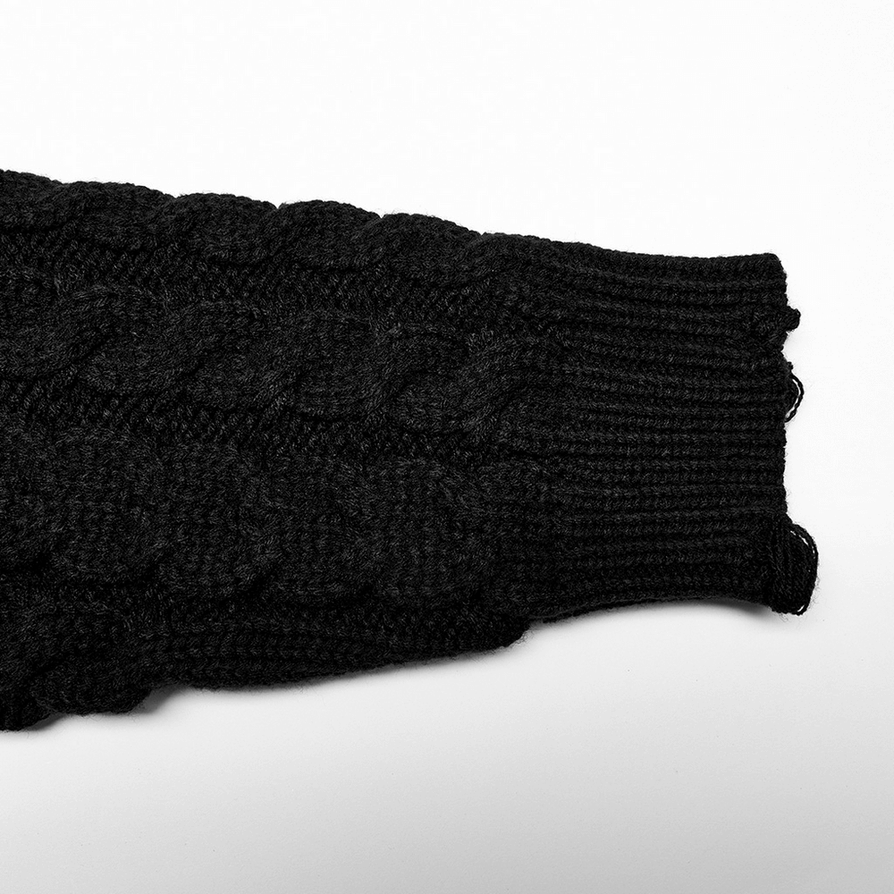 Close-up of the elegant black knit turtleneck sweater sleeve with a cable pattern for women.