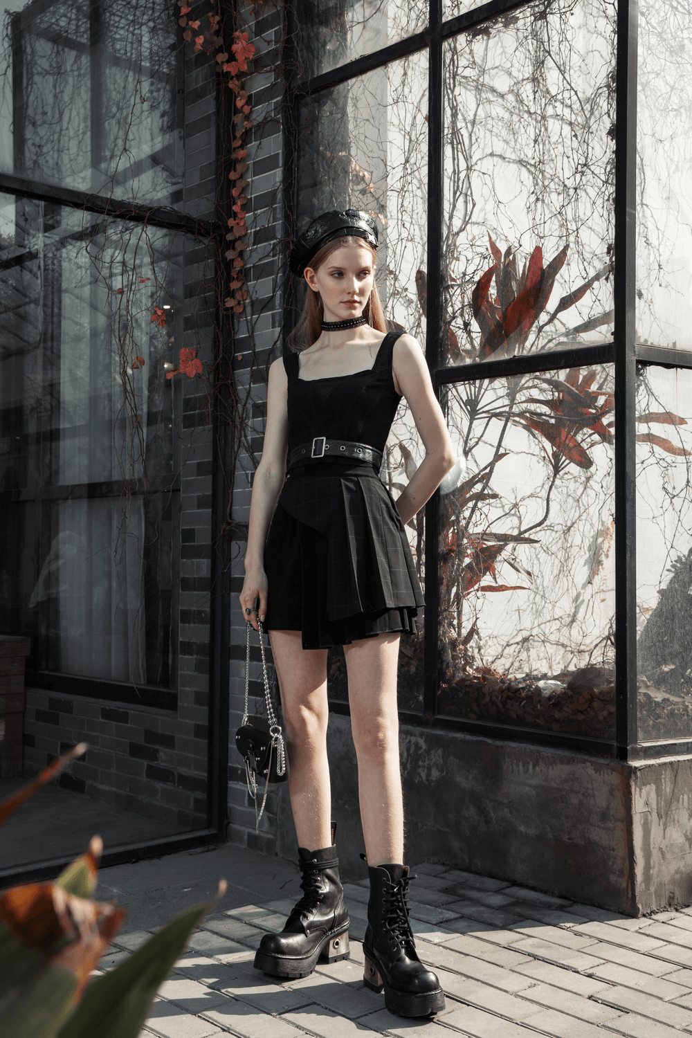 Chic dark plaid mesh top with detachable belt, showcasing elegance and style in an urban setting.