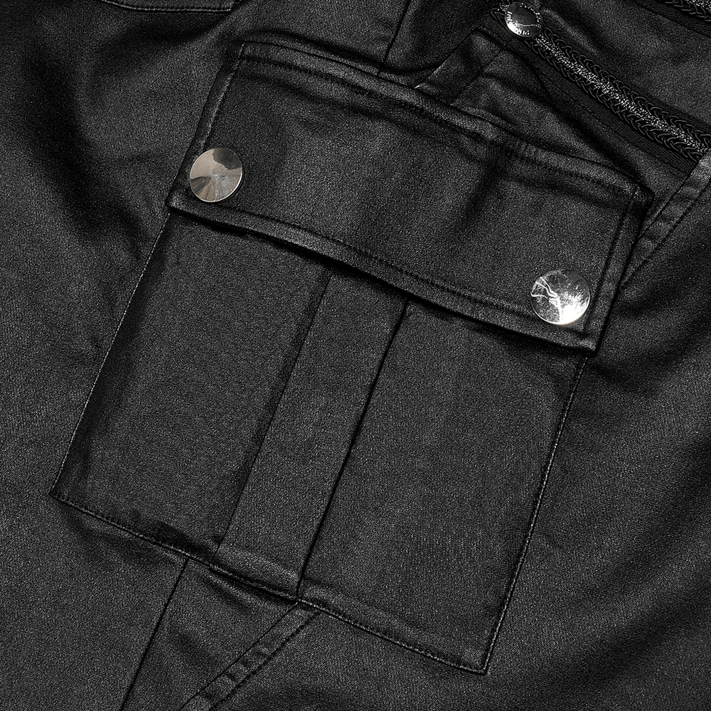 Close-up of black faux leather skirt pocket with shiny snap buttons, showcasing stylish punk details.