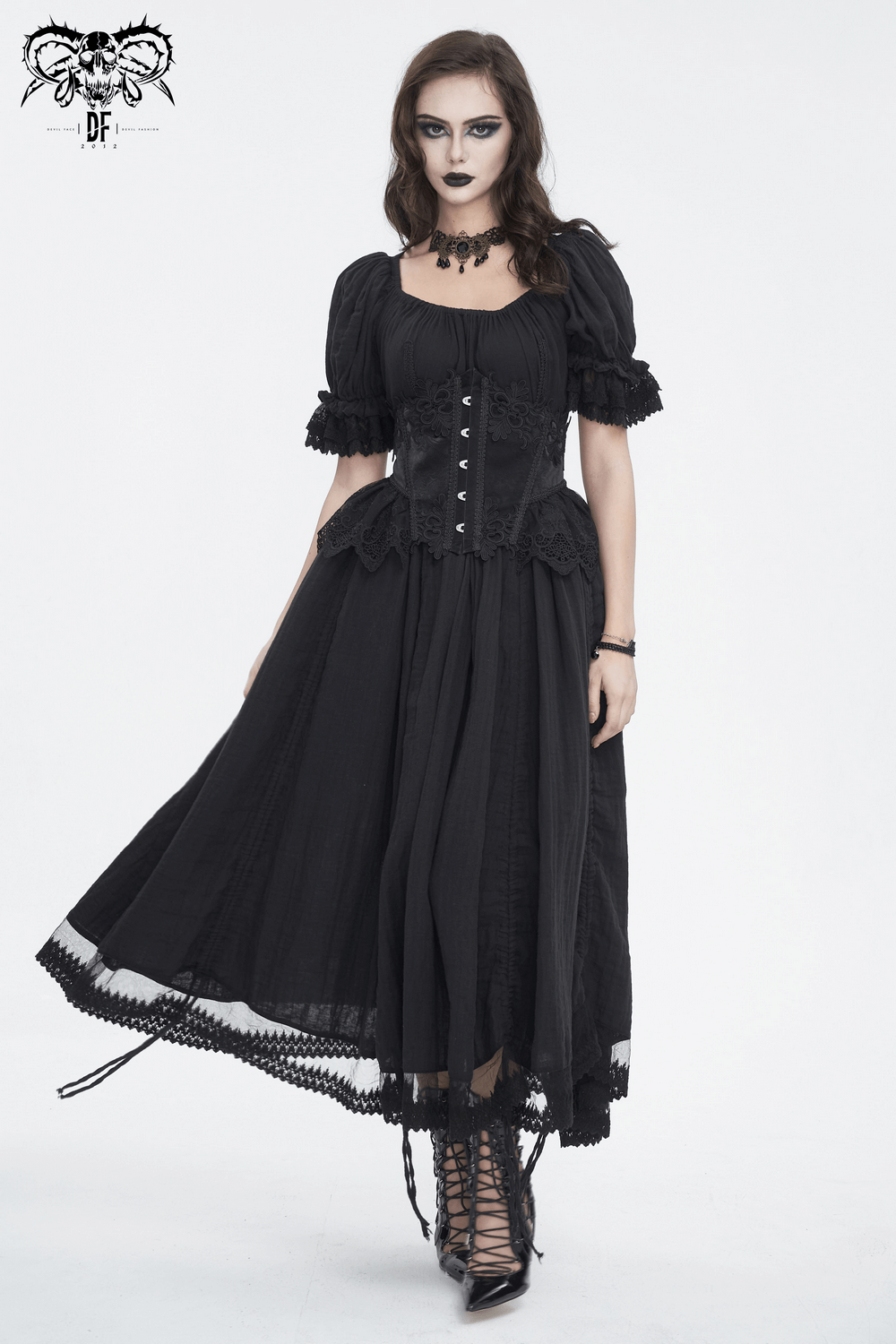 Chic black lace underbust corset with hook closure, paired with a flowing vintage-style dress for a seductive look.