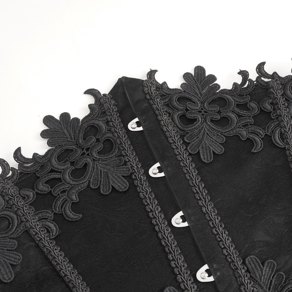 Close-up of our elegant black lace underbust corset with floral embroidery and hook closure.