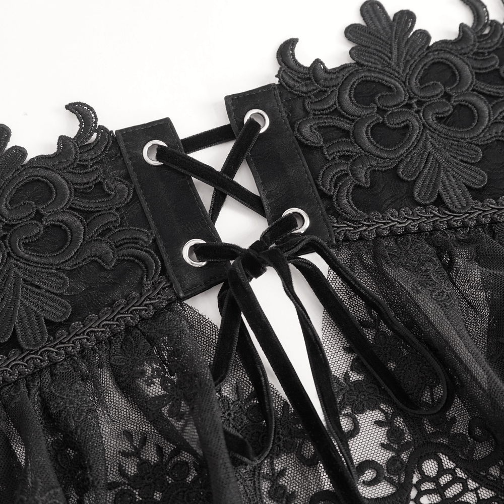 Close-up of floral embroidered black lace underbust corset with a hook and lace-up closure detail.
