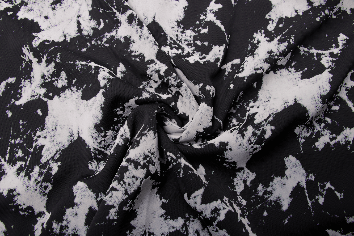 Close-up of a black and white abstract flocked fabric, showcasing a trendy and stylish design perfect for fashion-forward outfits.