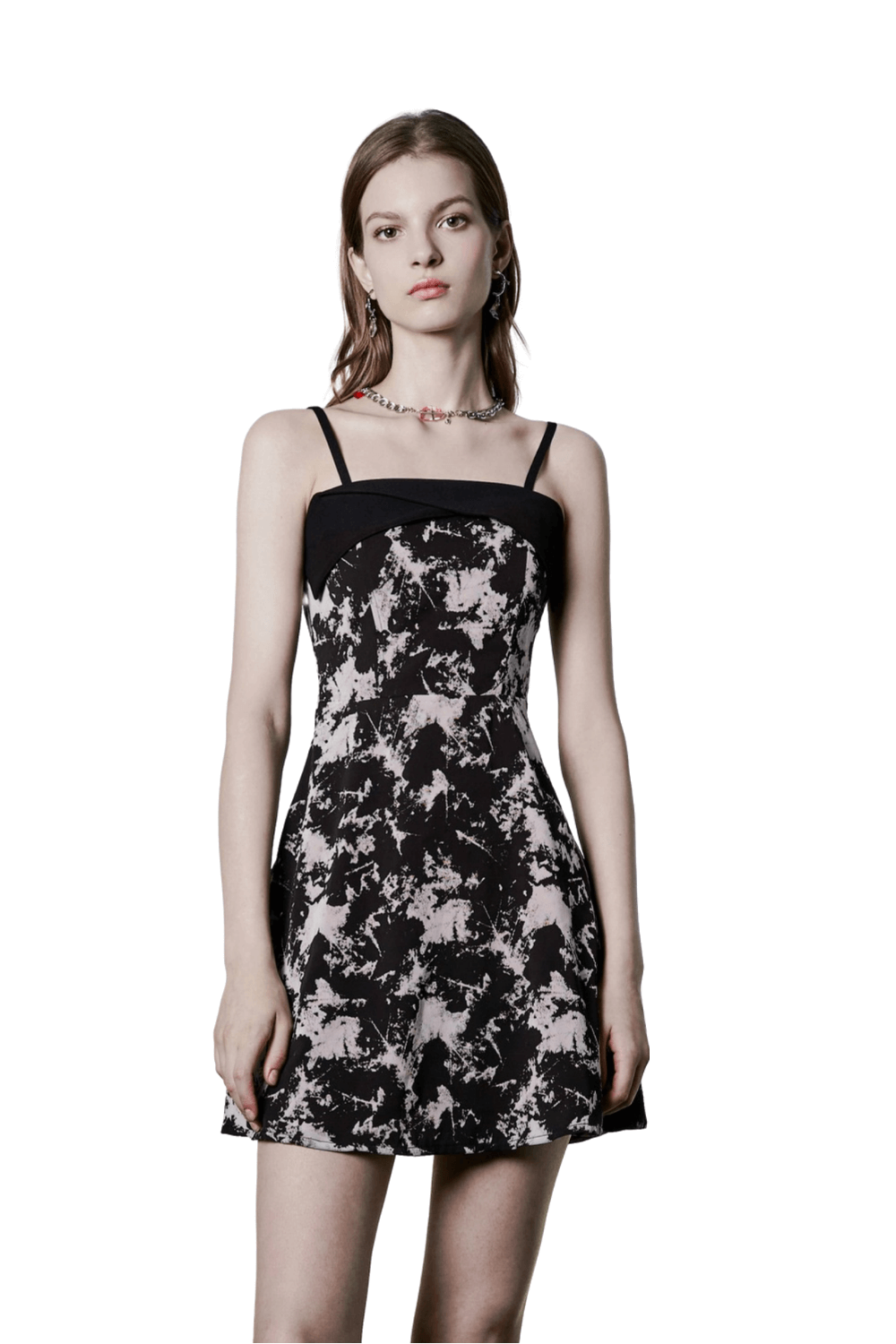 Chic black and white A-line mini dress with abstract flock pattern and broad shoulder straps.