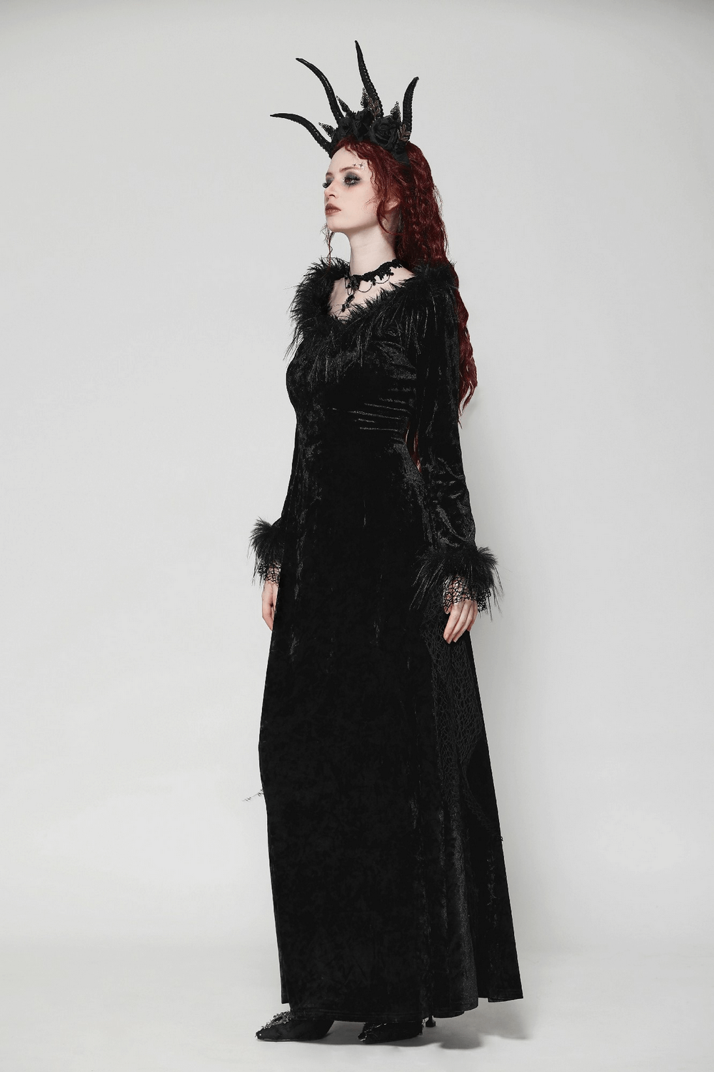 Chic goth velvet maxi dress with lace accents and dramatic horns, perfect for gothic events and bold fashion statements.