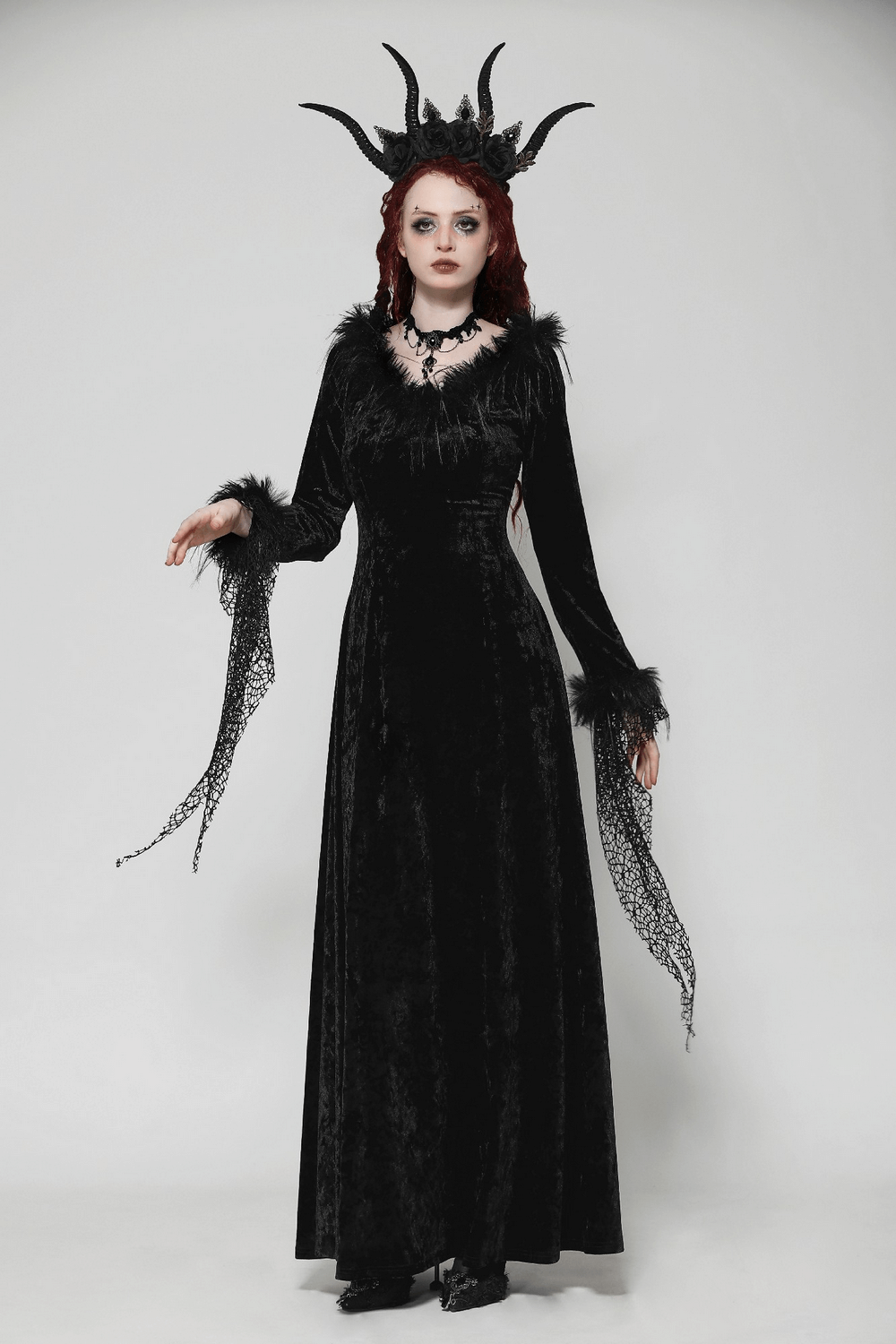 Chic goth velvet maxi dress with lace accents, dramatic sleeves, and stunning horned headpiece for gothic elegance.