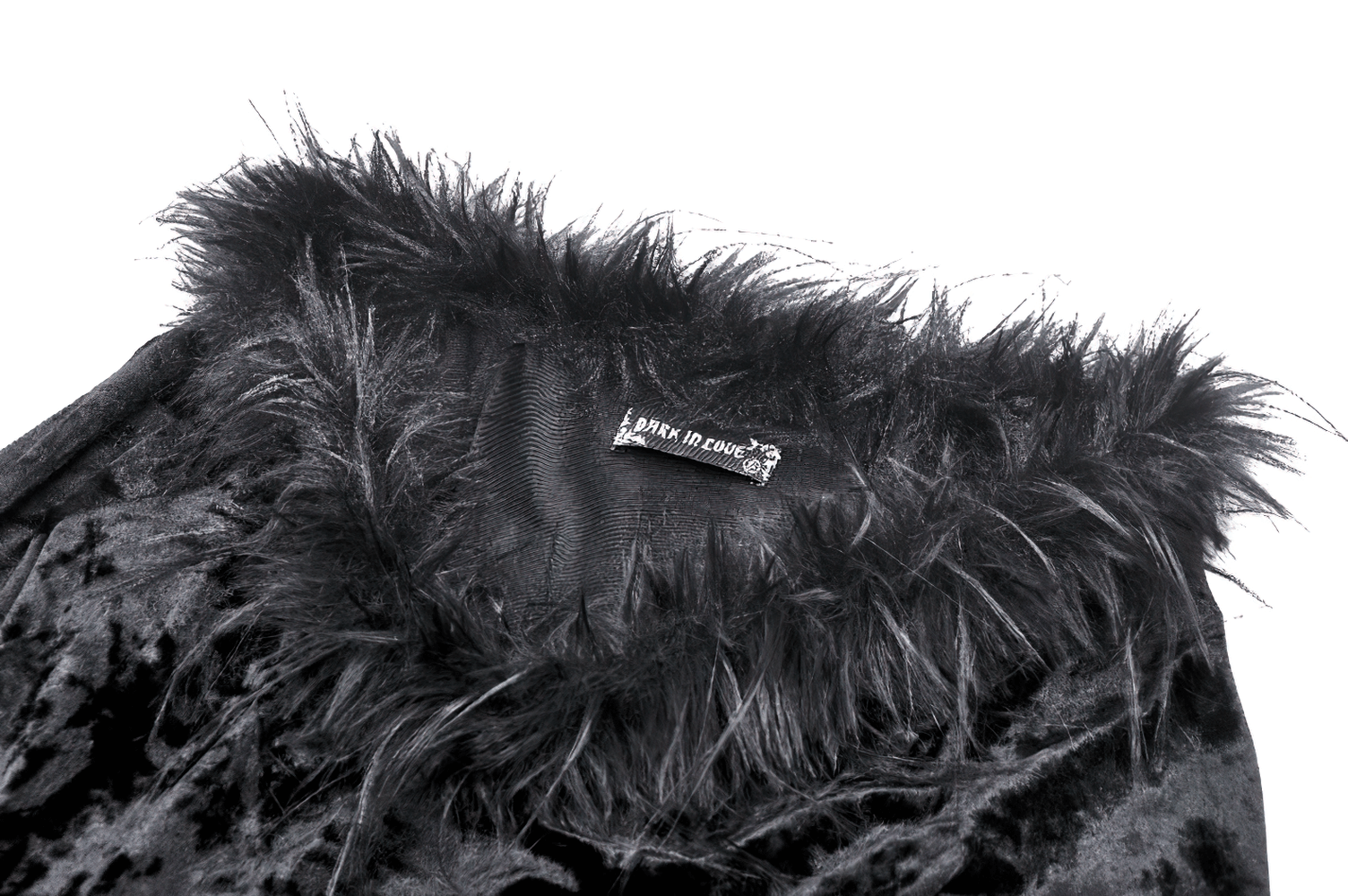 Close-up of the chic goth velvet dress collar with luxurious faux fur trim and elegant black velvet fabric.