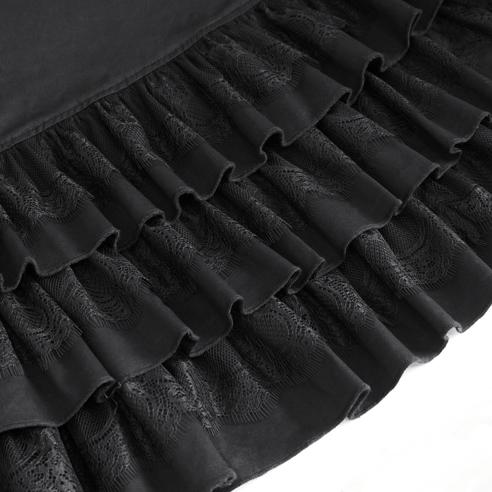 Close-up of black ruffled hem detailing on a chic gothic punk skirt, featuring textured layers and elegant flair.