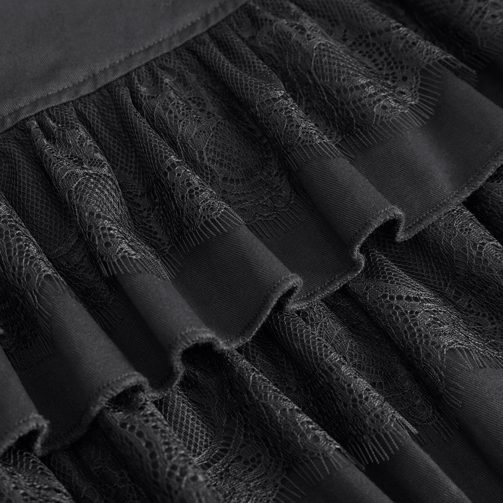 Chic black ruffled skirt detail with lace trim and layered hem, perfect for gothic punk style.