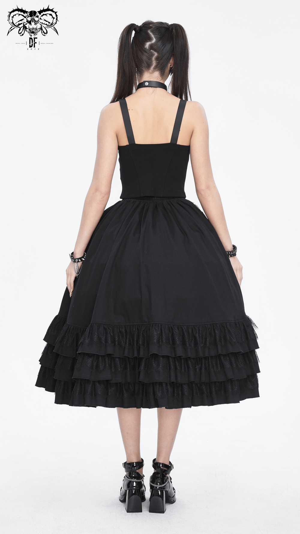 Back view of chic black gothic punk half skirt featuring ruffled hem and strapless bodice, perfect for evening wear.