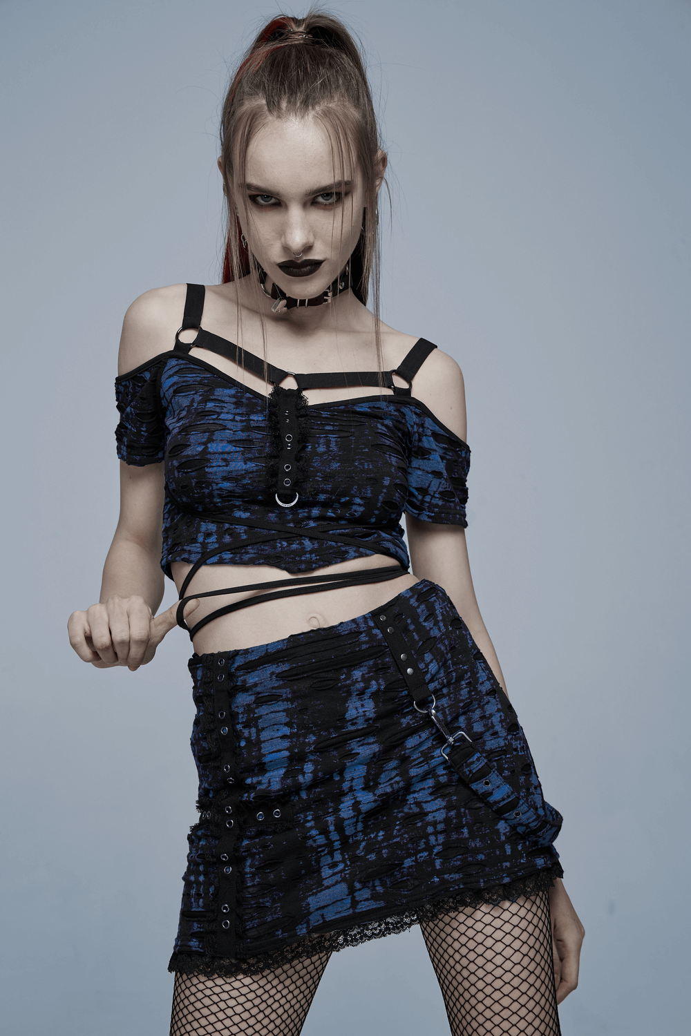 Chic Gothic suspender knit crop tee with rope detail, showcasing edgy print and stylish shoulder straps in blue.