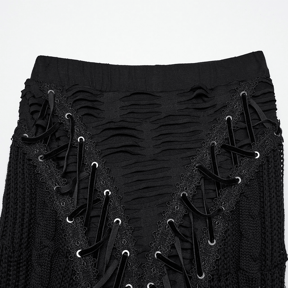 Chic Gothic tattered knit skirt with lace-up details and distressed textures, showcasing edgy asymmetric design.