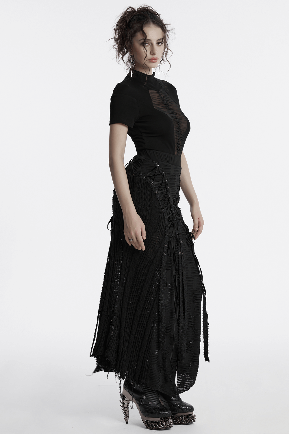 Chic Gothic tattered knit skirt with lace-up details, paired with a sleek black top for a rebellious look.