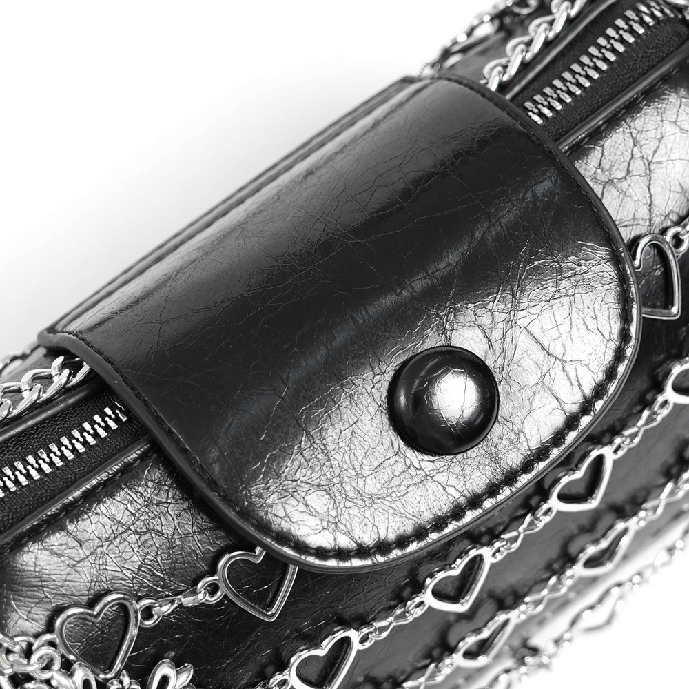 Close-up of chic black heart pattern crossbody bag with metallic chain detail and snap closure for women.