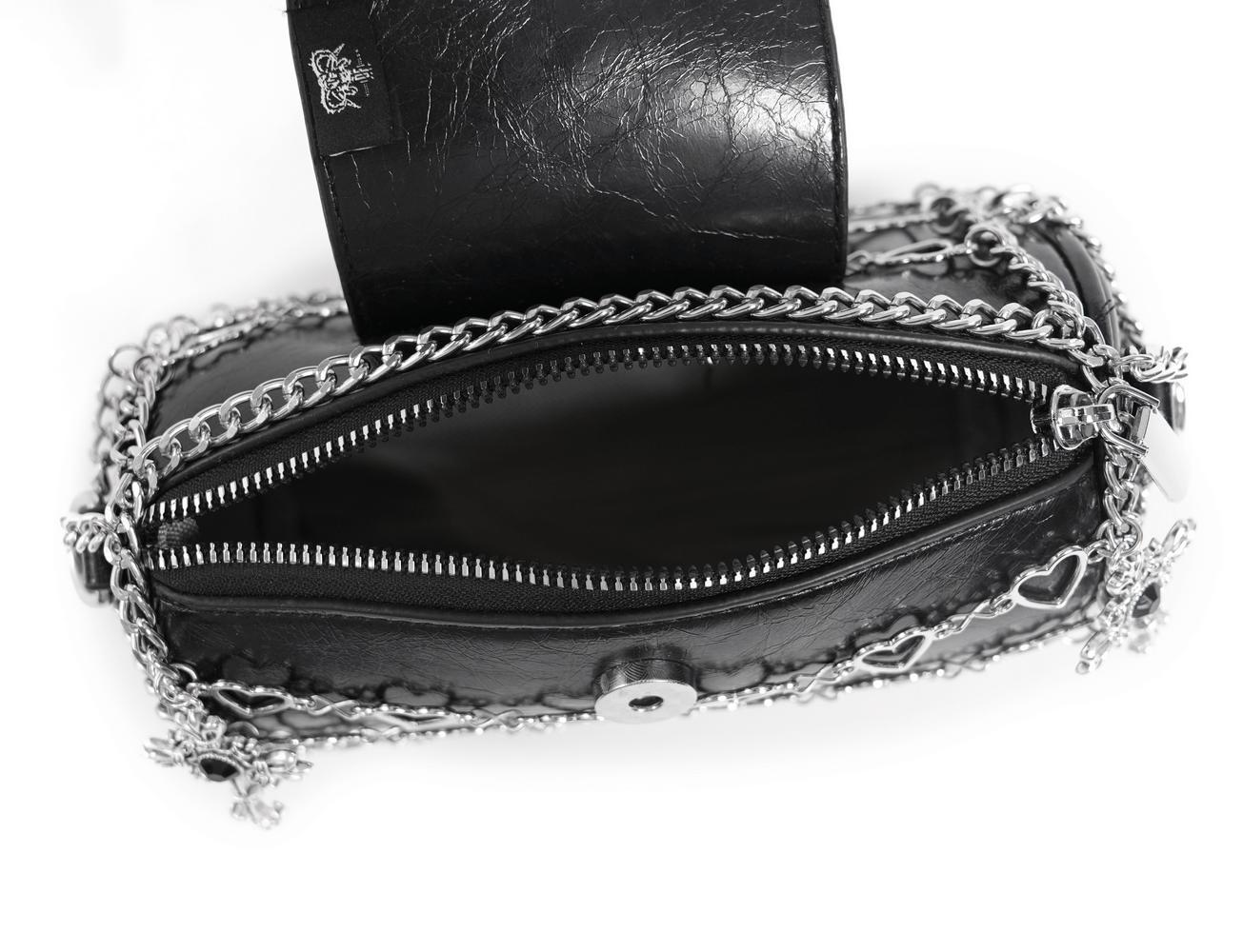 Inside view of a chic black heart pattern crossbody bag with metallic chain detailing and zip closure.
