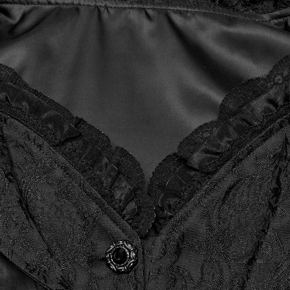 Close-up of chic high-low tailcoat interior featuring elegant jacquard lace and a stylish black button.