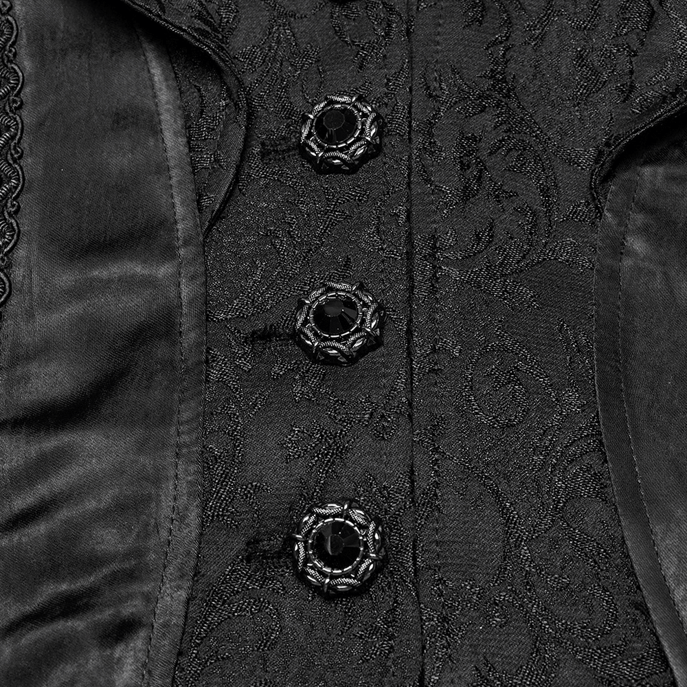 Close-up of chic high-low tailcoat featuring elegant jacquard lace and ornate black buttons.