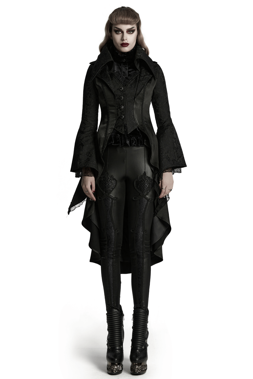 Chic high-low tailcoat with jacquard lace and buttons, styled edgy with fitted black pants and dramatic heels.