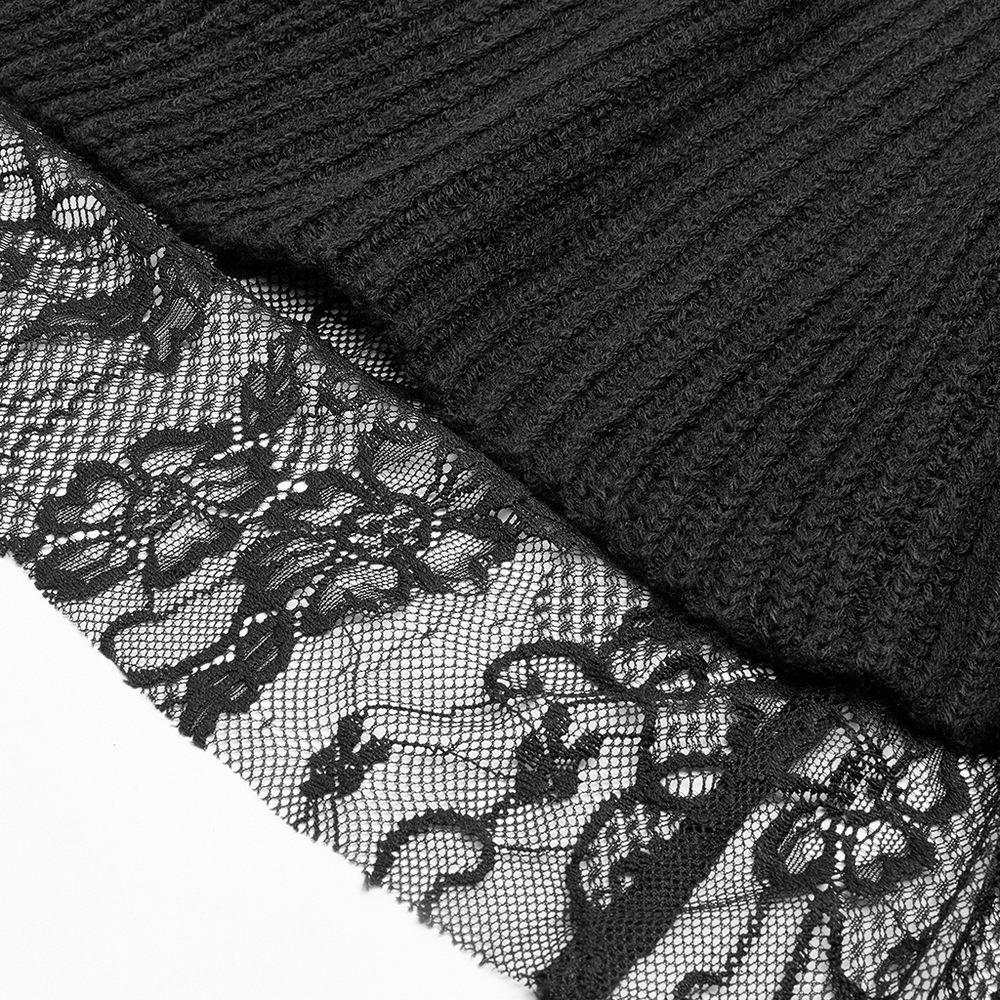 Close-up of black lace trim on woolen cloak, highlighting its gothic elegance and intricate craftsmanship.