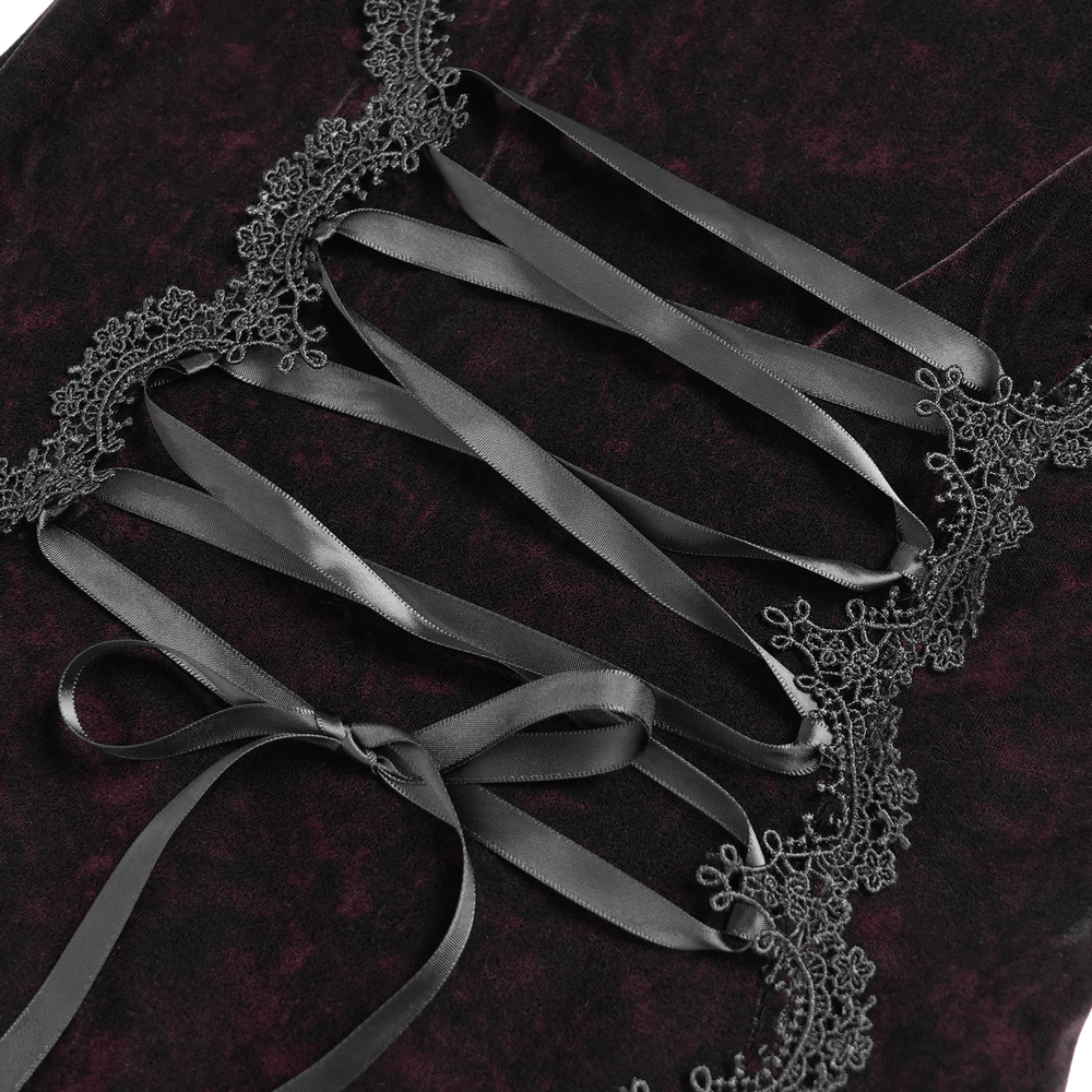 Detail of corset lacing on a chic hooded maxi dress featuring elegant lace accents and luxurious velvet fabric.
