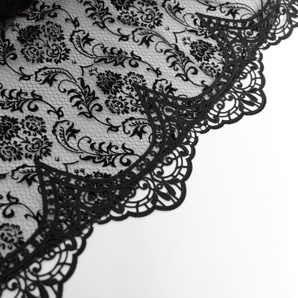 Intricate black lace fabric with floral pattern and elegant scalloped edge, perfect for gothic fashion.