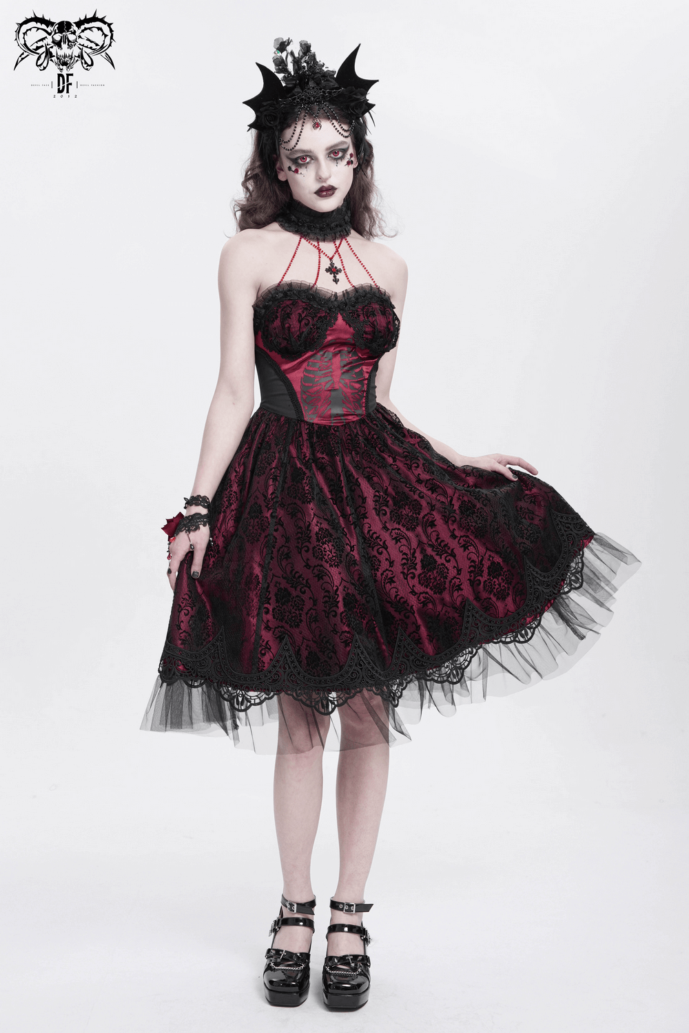 Gothic black and burgundy corset dress with lace and tulle, perfect for bold fashion statements.