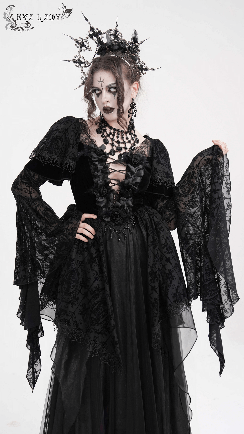 Elegant black gothic dress with lace bell sleeves, ruffled bodice, and intricate floral details for a dramatic look.