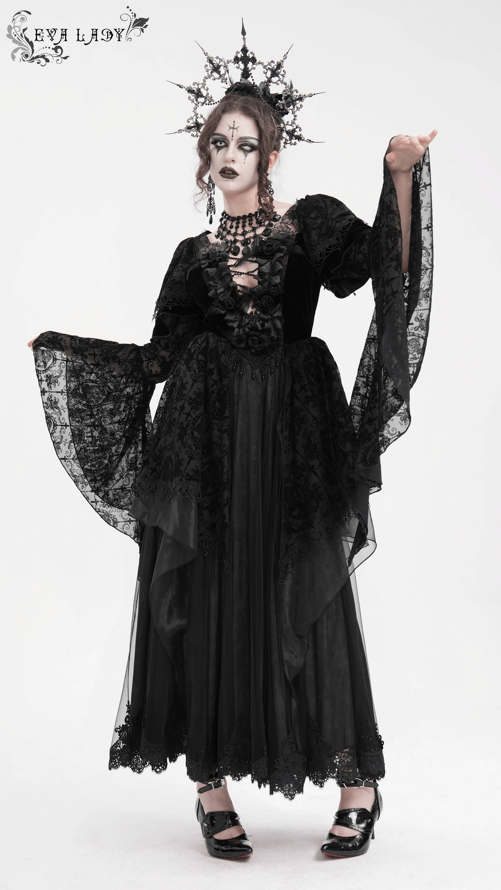 Elegant black Gothic dress with lace and bell sleeves, floral accents, and striking crown, perfect for dramatic style.