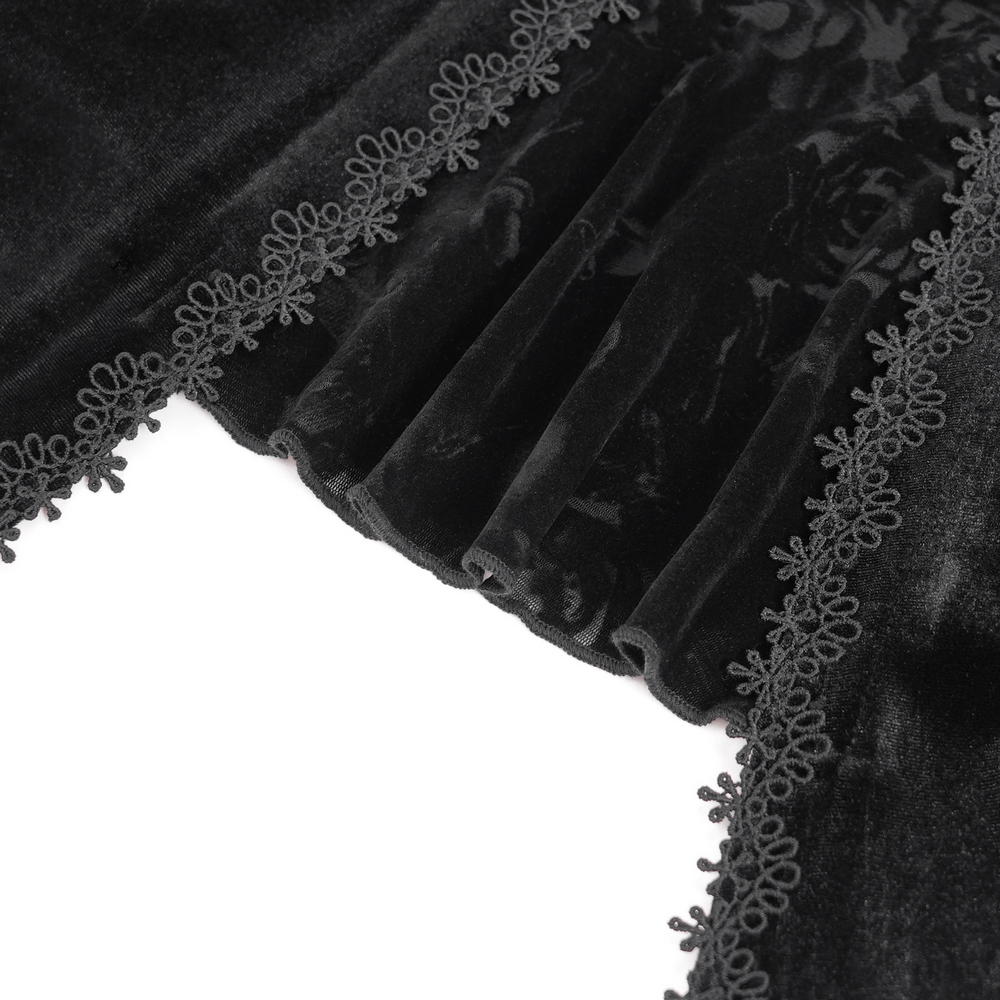 Close-up of elegant black lace detailing with rose pattern on gothic top, showcasing luxurious texture and design.