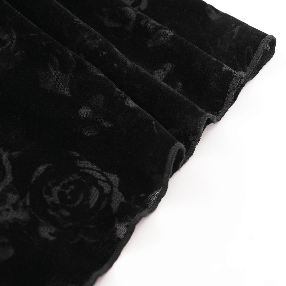 Close-up of black lace fabric featuring an elegant rose pattern, perfect for gothic-inspired fashion.