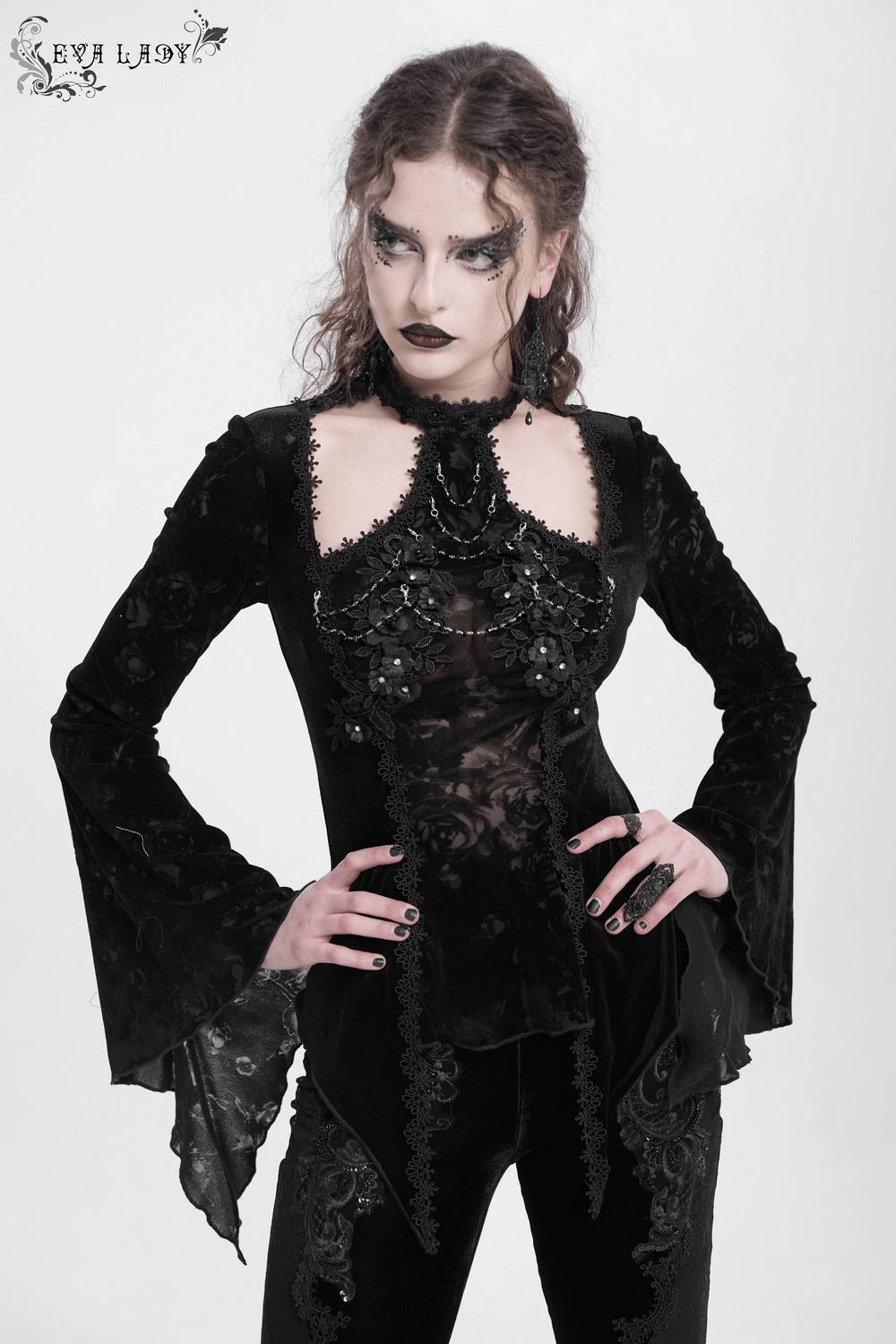 Elegant gothic long-sleeved top with lace, pearls, and a dramatic silhouette for a darkly refined look.