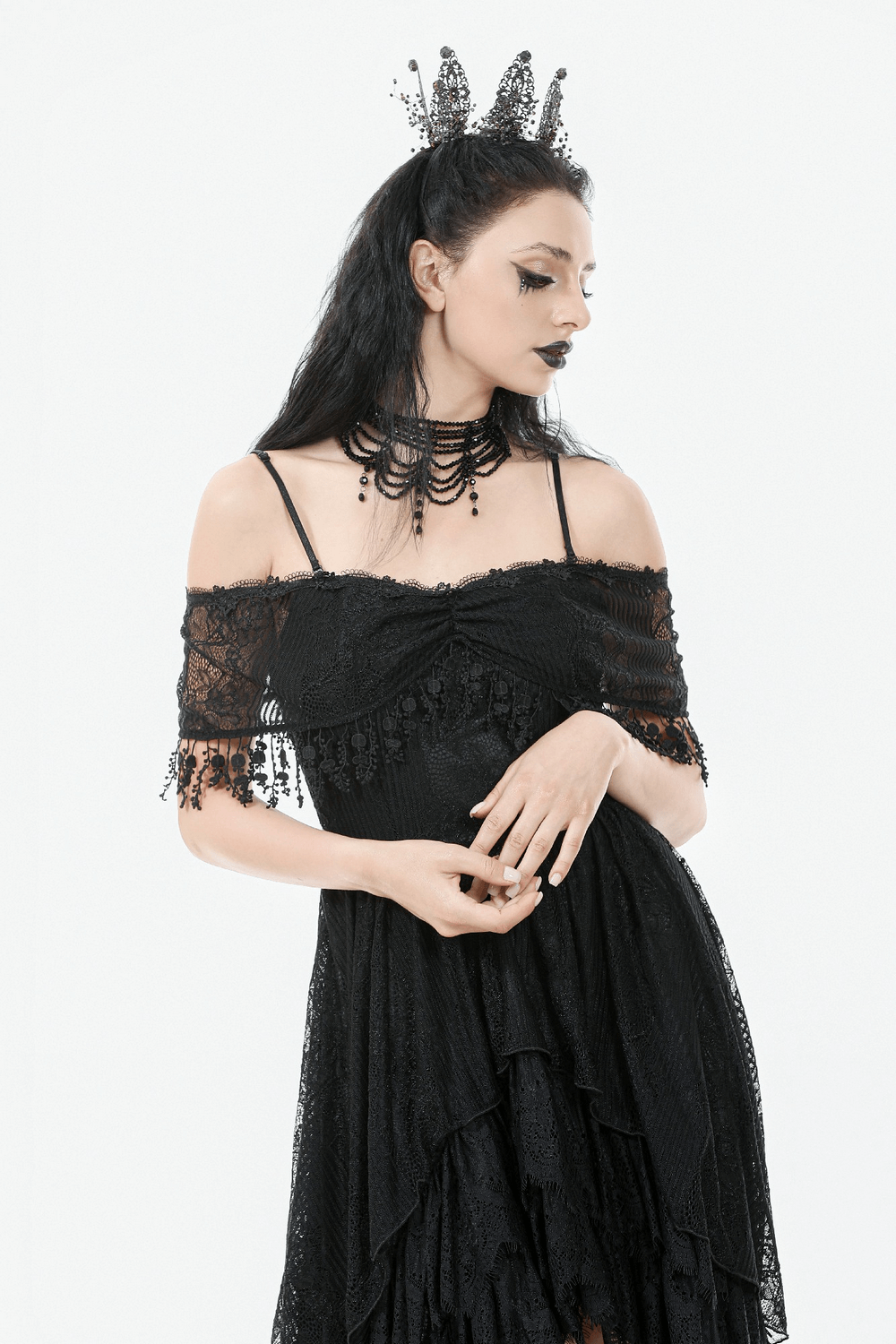 Chic Lace Off-Shoulder Dress with Corset and Ruffle Details modeled by a woman in gothic style with accessories.