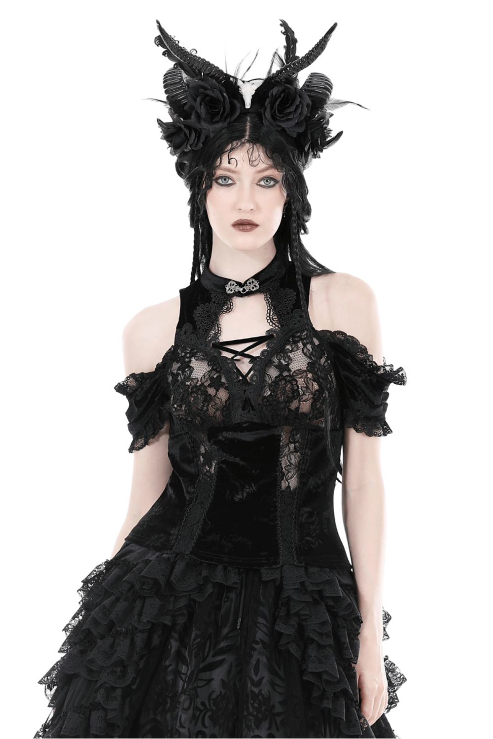 Chic black lace cold shoulder top with intricate patterns, paired with a gothic-inspired hairstyle and striking accessories.