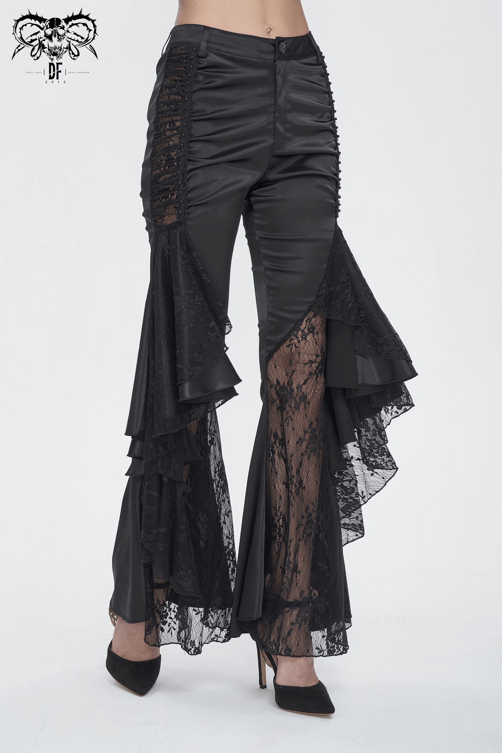 Chic gothic black lace-paneled flared pants with dramatic ruffles for a stunning evening look.