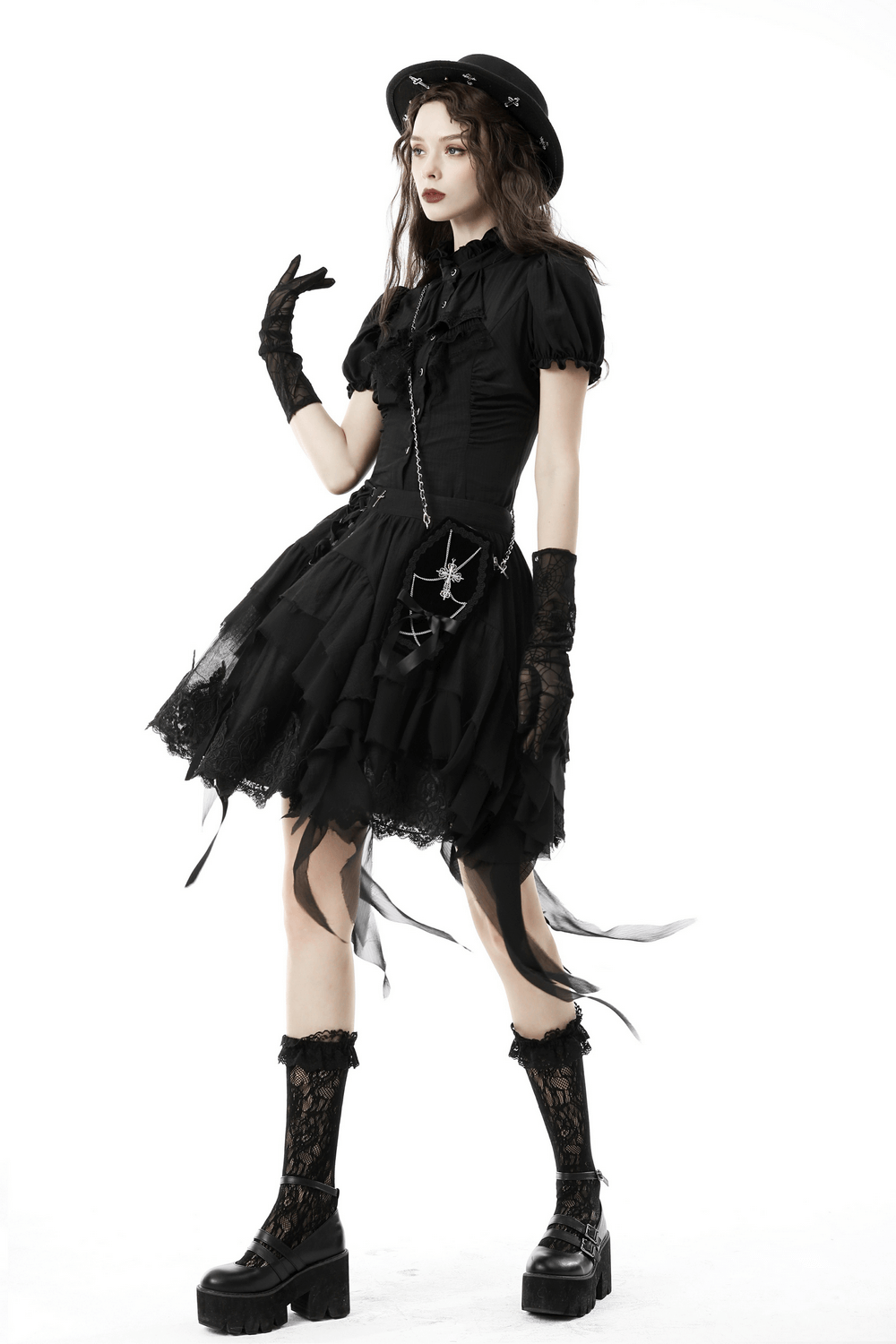Model showcasing a chic black lace-trimmed gothic blouse with puff sleeves, stylish gloves, and platform boots.