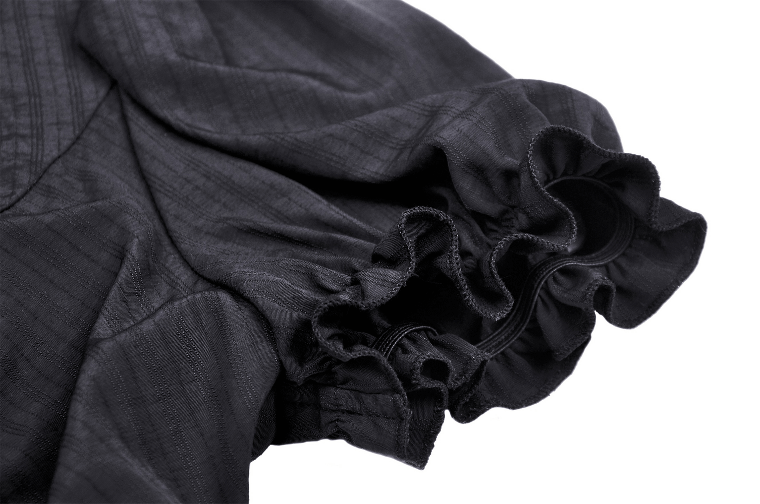 Close-up of black lace-trimmed puff sleeve, showcasing ruffled cuffs and elegant detailing.