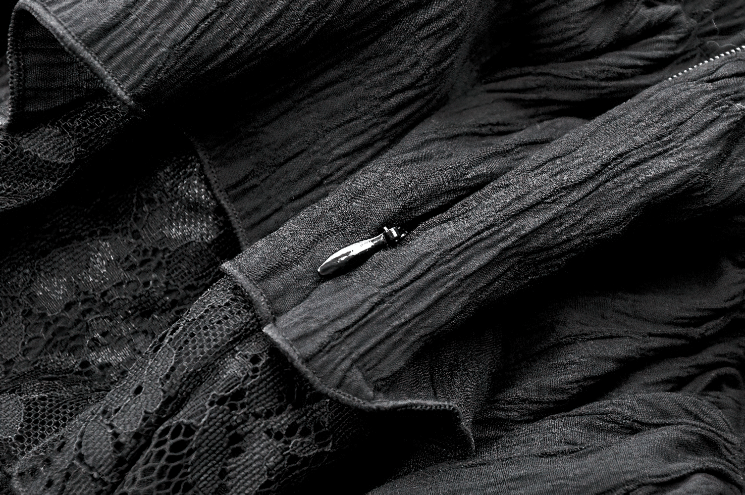 Chic Layered Ruffle Tailcoat Lantern Shorts for Women showcasing intricate lace and textured fabric details.