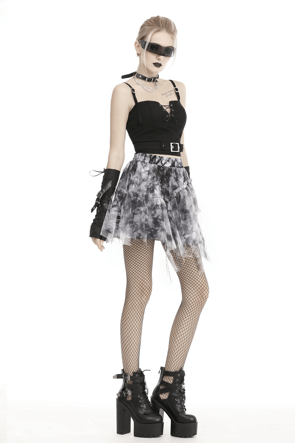 Chic marble print skirt with edgy accessories for a stylish and trendy look, perfect for fashion-forward individuals.