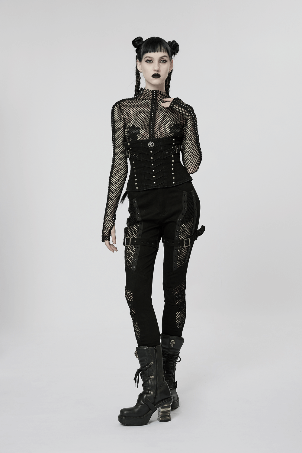 Chic gothic style mesh insert trousers with edgy details and punk allure, showcased by a stylish model.
