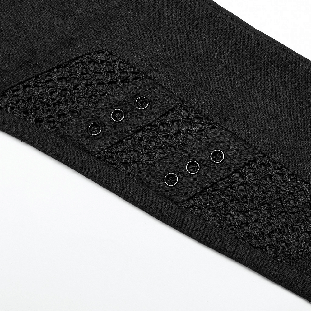 Close-up of black gothic trousers featuring mesh inserts and eyelets for edgy punk style.
