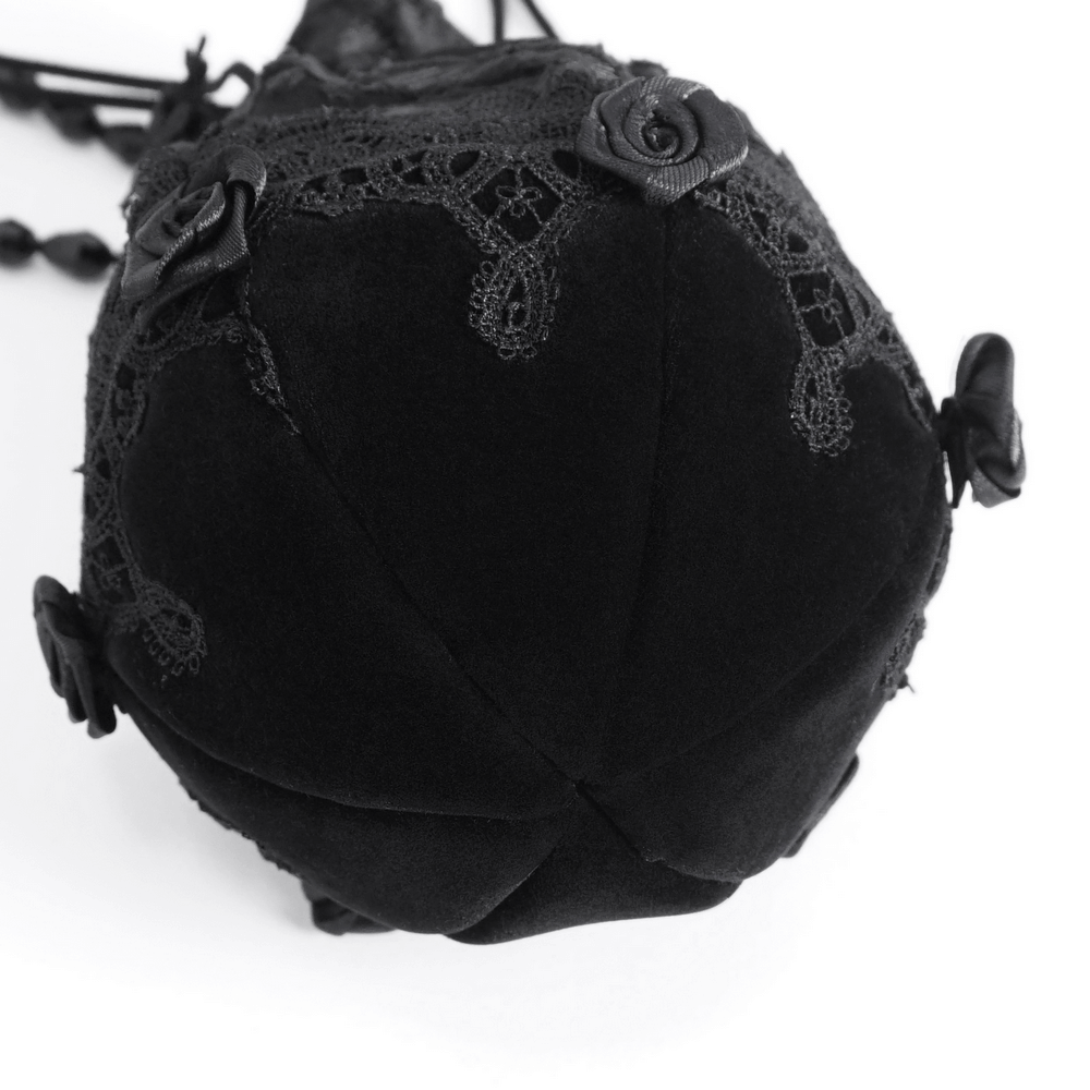 Top view of Chic Noir black evening bag with lace details and bead-chain strap, perfect for formal occasions.