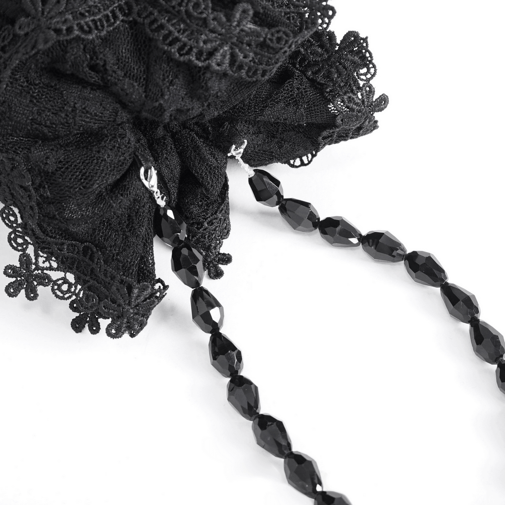 Elegant black lace evening bag featuring intricate lace details and a luxurious bead-chain strap.