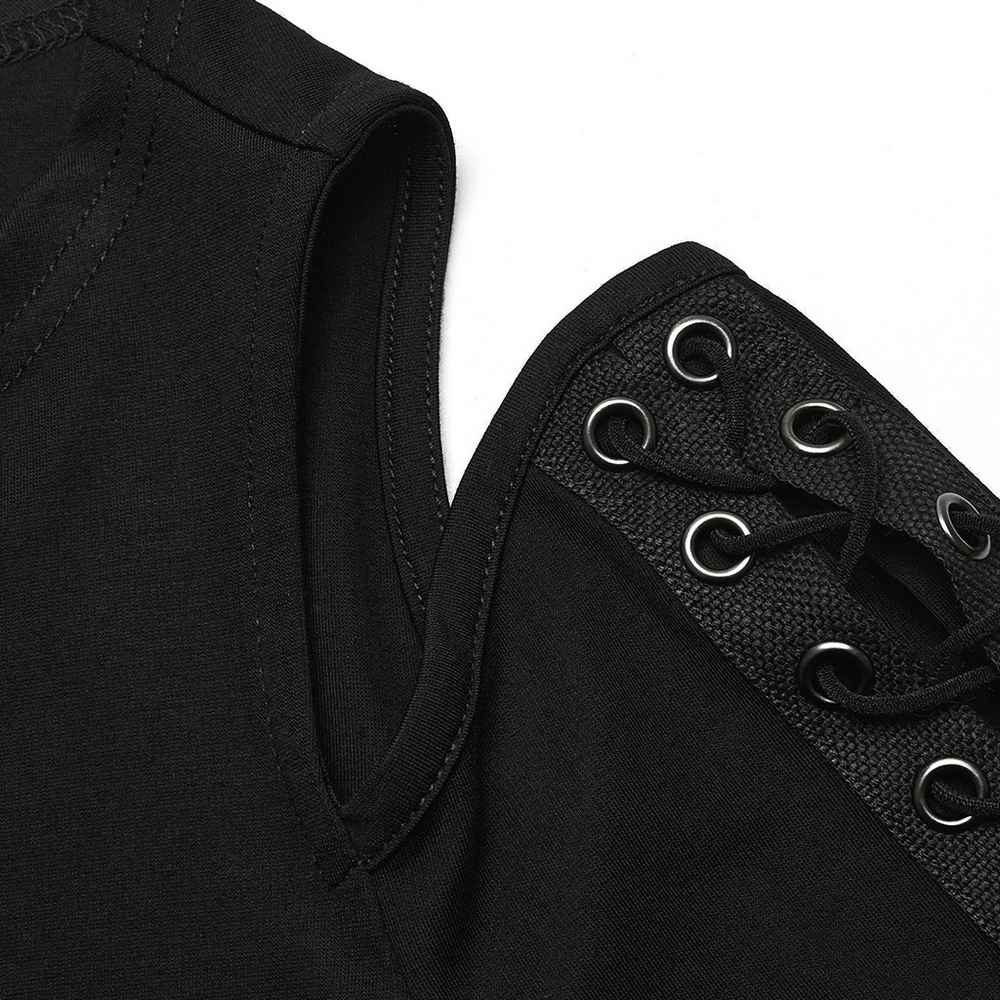 Close-up of black goth top shoulder with lace-up detailing and eyelets for stylish, edgy flair.