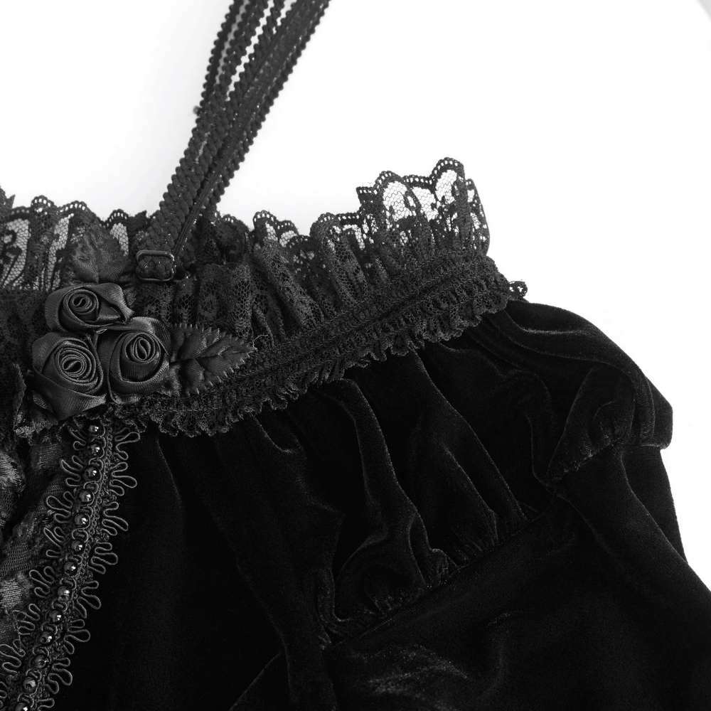 Elegant black velvet lingerie with lace trim and rose details, perfect for a romantic night in.