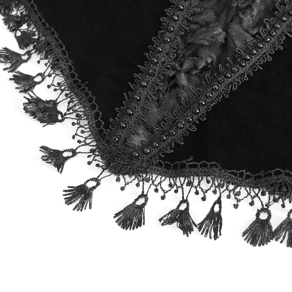 Close-up of black lace fabric with intricate fringe detailing, perfect for a chic off-the-shoulder top.